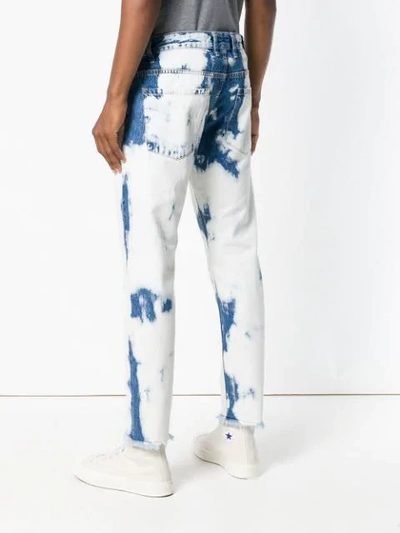 Shop Represent Wash Out Jeans In Blue