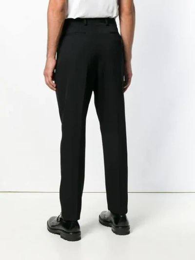 Shop Givenchy Tapered Trousers In Black