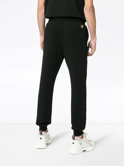 Shop Versace Embroidered Medusa Logo Cotton Sweatpants In A008 Black