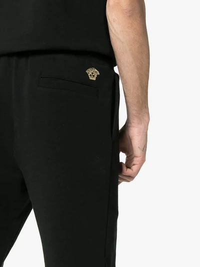 Shop Versace Embroidered Medusa Logo Cotton Sweatpants In A008 Black