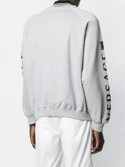Shop Versace Logo Embroidered Sweatshirt In Grey