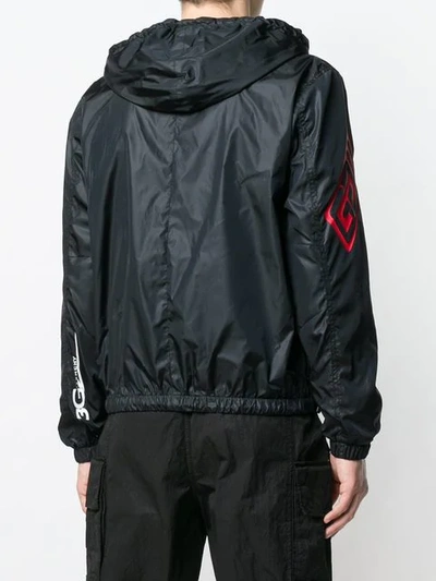 Shop Givenchy Logo Print Shell Jacket In Black