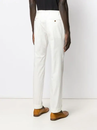 Shop Corneliani Slim-fit Trousers - White