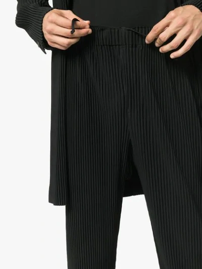 Shop Issey Miyake Homme Plissé  Ribbed Cropped Trousers - Black