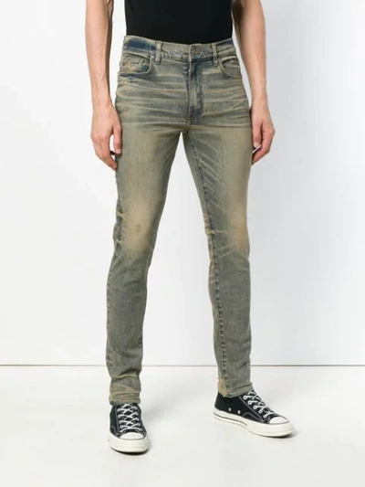 Shop Amiri Faded Skinny Jeans In Blue