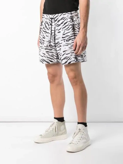 Shop Amiri Tiger Print Shorts In White