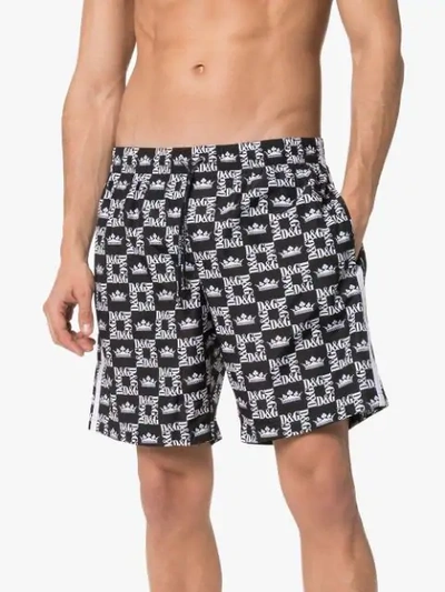 Shop Dolce & Gabbana Logo Printed Swim Shorts In Black