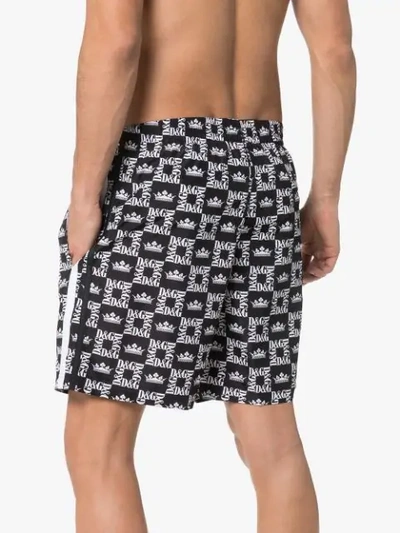 Shop Dolce & Gabbana Logo Printed Swim Shorts In Black