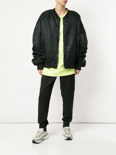 Shop Juunj Oversized Bomber Jacket In Black