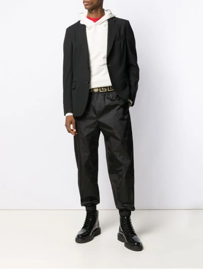 Shop Versace Elasticated Logo Track Trousers - Black