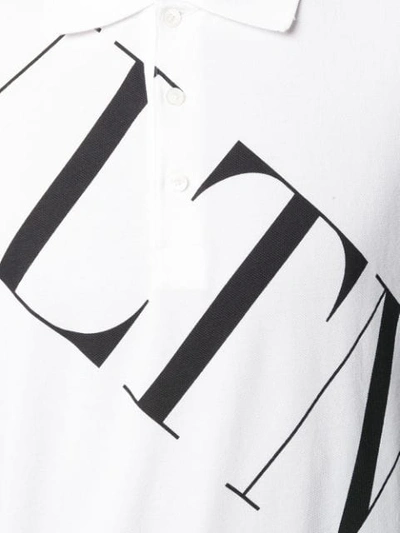 Shop Valentino Vltn Print Polo Shirt In A01 Biaco Nero