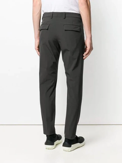 Shop Prada Checked Slim Fit Trousers In Grey
