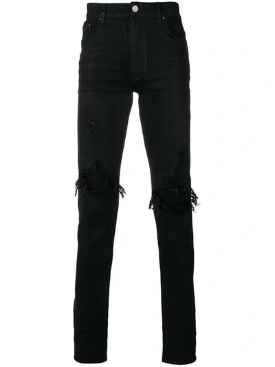 Shop Amiri Ripped Skinny Jeans In Black