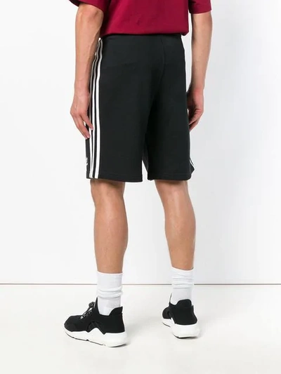 Shop Adidas Originals Three Stripe Track Shorts In Black