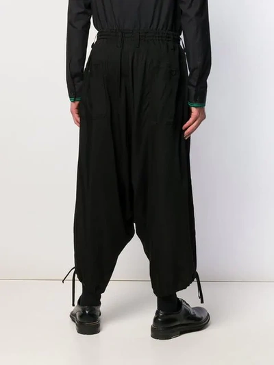 Shop Yohji Yamamoto Drop Crotch Trousers - Black