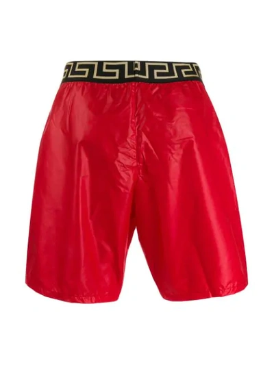 Shop Versace Logo Elasticated Swim Shorts In A85n Rosso Elastico Nero-or 