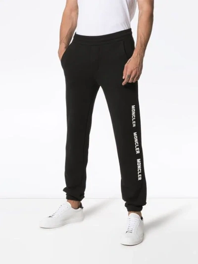 Shop Moncler Logo Print Track Pants - Black