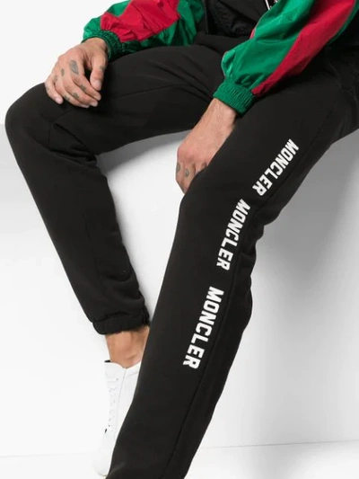 Shop Moncler Logo Print Track Pants - Black