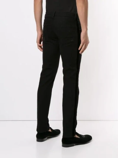 Shop Dolce & Gabbana Distressed Logo Patch Jeans In Black