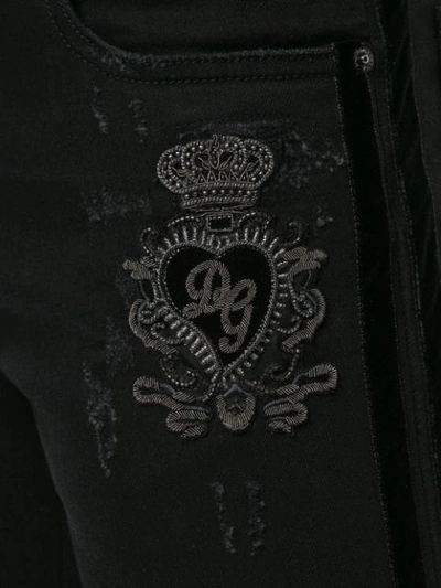 Shop Dolce & Gabbana Distressed Logo Patch Jeans In Black