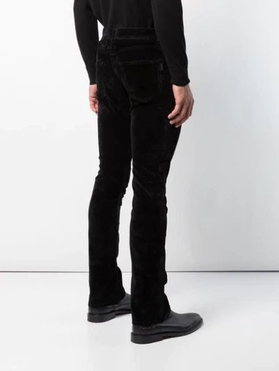 Shop Saint Laurent Slim Bootcut Jeans - Black