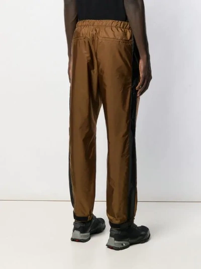 Shop Prada Technical Fabric Trousers In Brown