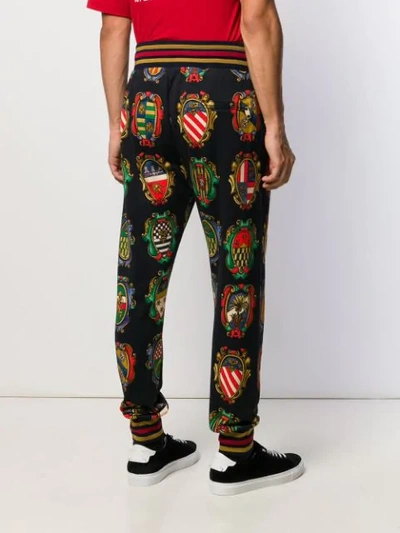 Shop Dolce & Gabbana Plaque Track Pants In Black