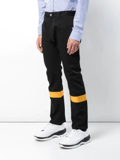 Shop Junya Watanabe Contrast Stripe Trousers In Black