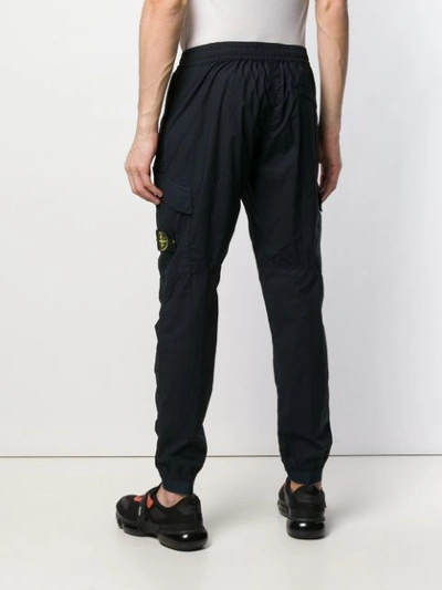 Shop Stone Island Tapered Technical Trousers - Blue