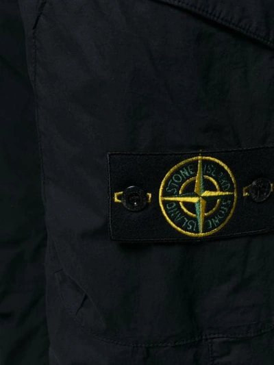 Shop Stone Island Tapered Technical Trousers - Blue