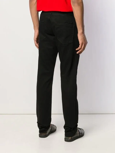 Shop Philipp Plein Straight Cut Statement Jeans In Black