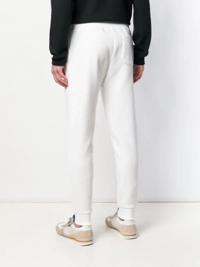 Shop Polo Ralph Lauren Drawstring Track Trousers In White