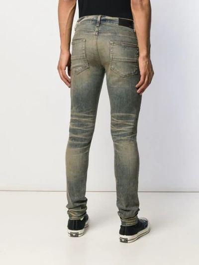 Shop Amiri Stack Skinny Jeans In Blue