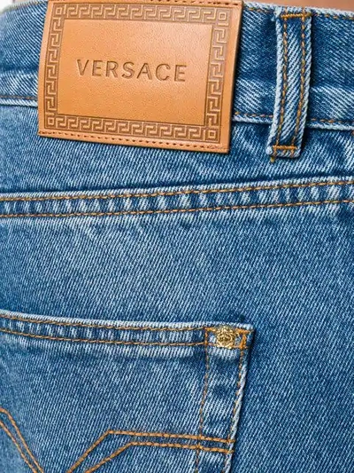 Shop Versace Baggy Straight Jeans In Blue