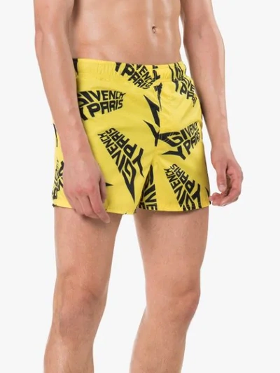 Shop Givenchy Logo Print Swim Shorts In Yellow