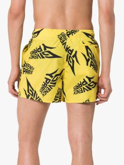 Shop Givenchy Logo Print Swim Shorts In Yellow