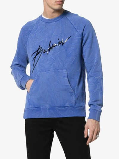 Shop Balmain Logo Print Faded Cotton Sweatshirt In Blue