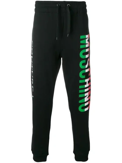 Shop Moschino Italian Logo Track Trousers In Black