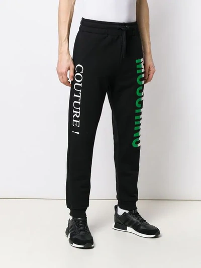 Shop Moschino Italian Logo Track Trousers In Black