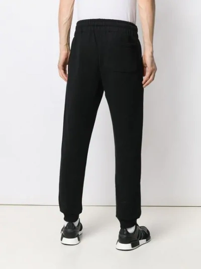 Shop Moschino Italian Logo Track Trousers In Black