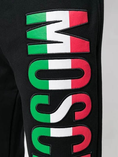 Shop Moschino Italian Logo Track Trousers In Black