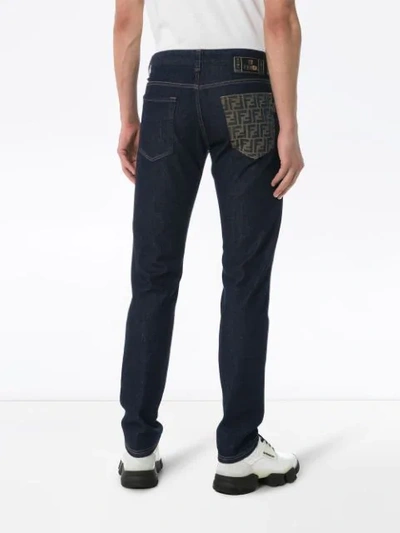 Shop Fendi Schmale Jeans Mit Logo-tasche In Blue
