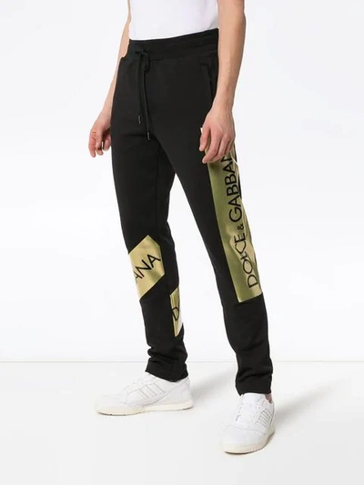 Shop Dolce & Gabbana Logo Stripe Track Pants In N0000 Black