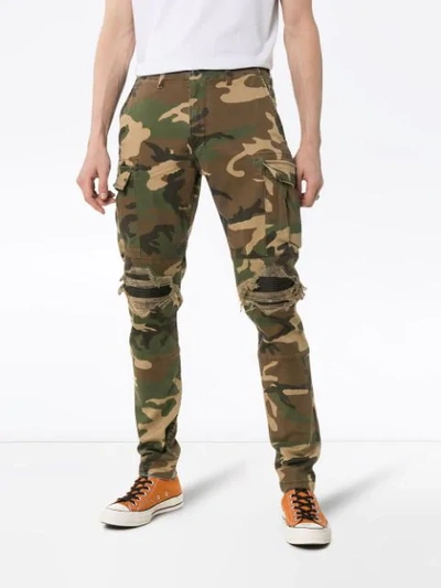 Shop Amiri Camouflage Print Cargo Trousers In Green