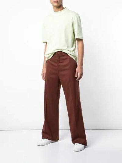 Shop Lanvin Flared High Waisted Trousers In Red