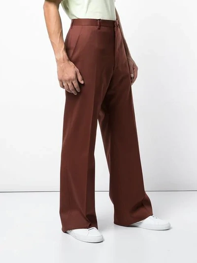 Shop Lanvin Flared High Waisted Trousers In Red