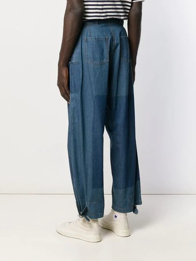 Shop Jw Anderson Belted Denim Trousers In Blue