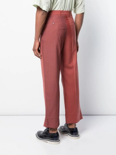 Shop Marni Panelled Striped Trousers In Red