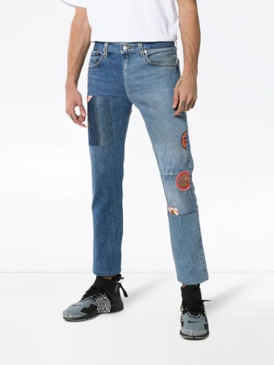 Shop Children Of The Discordance Mid Rise Contrasting Denim Patch Jeans In Blue