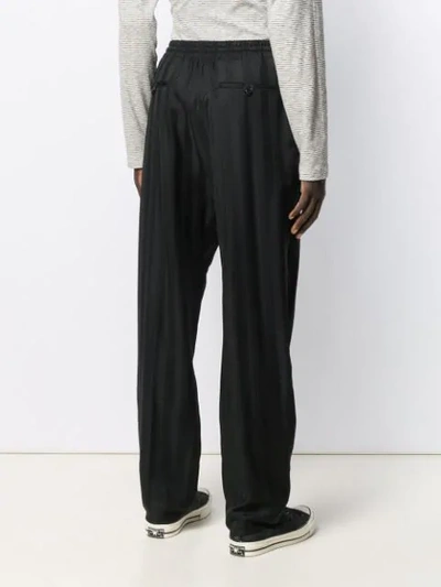 Shop Saint Laurent Belted Straight Trousers In Black